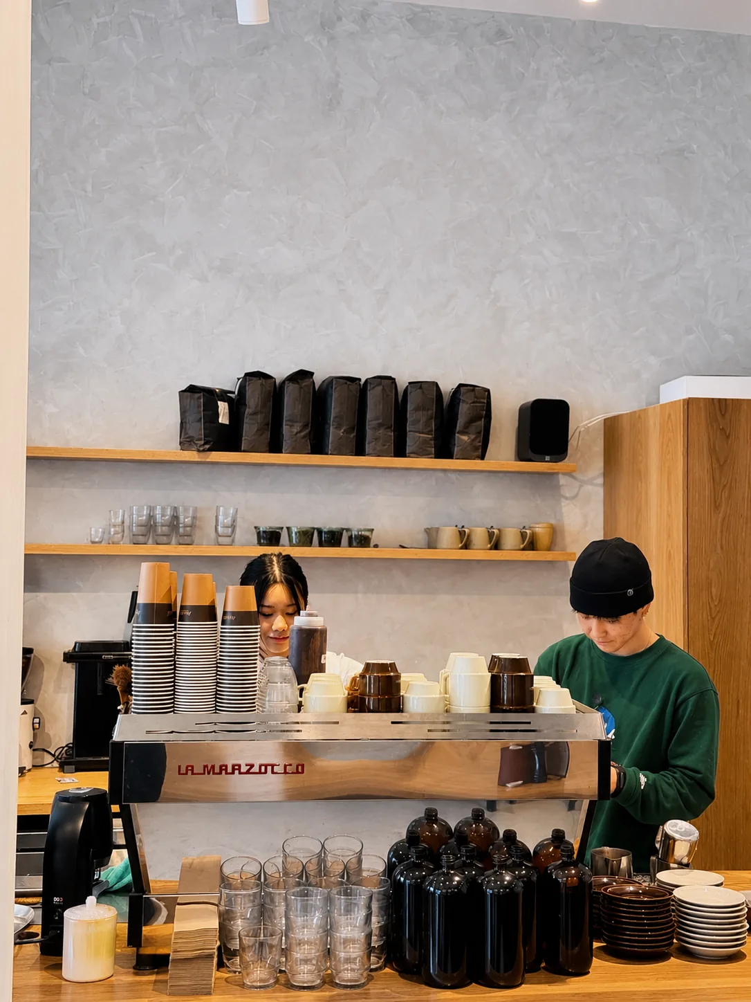 Akin Cafe team working behind the espresso bar
